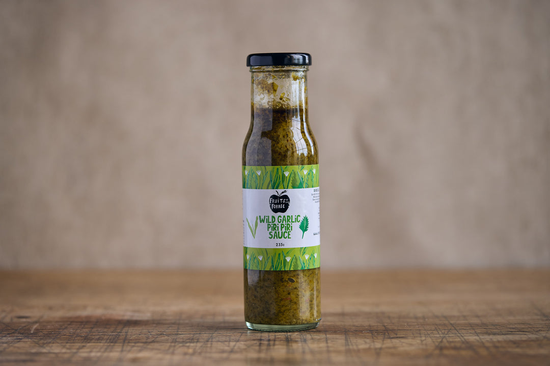 Bottle of Wild Garlic Herb Sauce on a wooden surface with a brown background