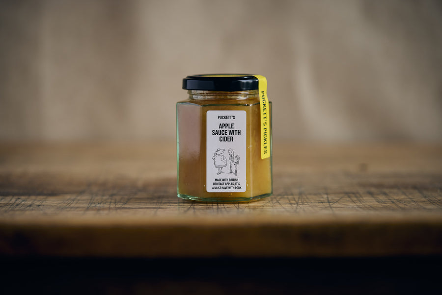 Apple Sauce in a jar on a wooden table 